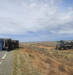Truck rolls on highway
