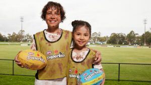 Junior players kick goals in footy boom